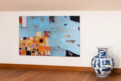 a painting on a wall next to a vase at Résidence Grand Studio à 3 Min De La Croisette - Grand Studio à 3 min de la Croisette MAE-2823 in Cannes