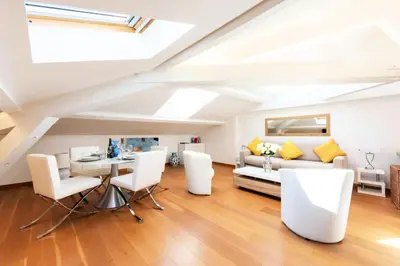 a living room with white furniture and a skylight at Résidence Grand Studio à 3 Min De La Croisette - Grand Studio à 3 min de la Croisette MAE-2823 in Cannes