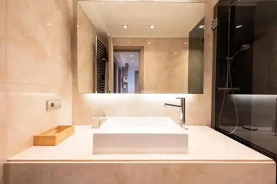 a bathroom with a white sink and a mirror at Résidence 2 Pièces Croisette, Face Palais Des Congrès - 2 pièces Croisette, Face Palais des Congrès MAE-2833 in Cannes
