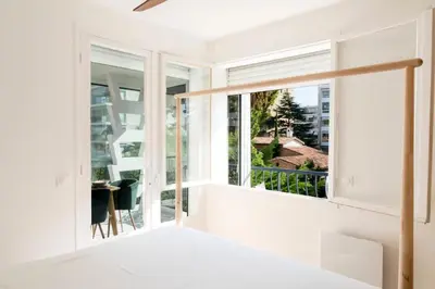 a bedroom with a large window and a desk at Résidence Lumineux 2p, Plages à Pied - Lumineux 2P, plages à pied MAE-2843 in Cannes
