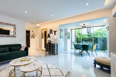 a living room with a couch and a table at Résidence Rare ! 3p Piscines, Plages Et Parking - RARE ! 3P piscines, plages et parking MAE-2853 in Cannes