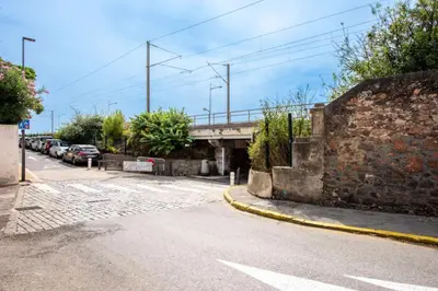an empty street with a bridge and cars parked at Résidence Rare ! 3p Piscines, Plages Et Parking - RARE ! 3P piscines, plages et parking MAE-2853 in Cannes