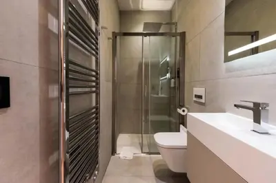a bathroom with a shower and a toilet and a sink at Résidence Duplex 145m² Terrasse Et Ascenseur Privé - DUPLEX 145m² Terrasse et Ascenseur Privé MAE-2873 in Cannes