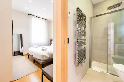 a bathroom with a shower and a bedroom with a bed at Résidence Duplex 145m² Terrasse Et Ascenseur Privé - DUPLEX 145m² Terrasse et Ascenseur Privé MAE-2873 in Cannes
