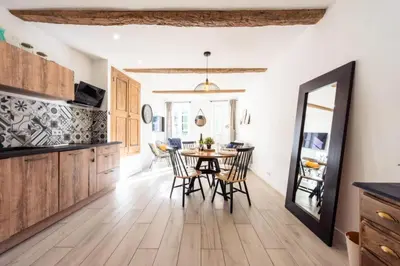 a kitchen and dining room with a table and chairs at Résidence 3p Centre Cannes Suquet - 3P Centre Cannes Suquet MAE-2903 in Cannes