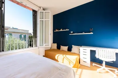 a bedroom with blue walls and a bed and a window at Résidence Villa 180m² 5p Cannes Piscine Garage - Villa 180m² 5P Cannes Piscine Garage MAE-2963 in Cannes