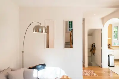 a living room with a couch and a floor lamp at Résidence Villa 180m² 5p Cannes Piscine Garage - Villa 180m² 5P Cannes Piscine Garage MAE-2963 in Cannes