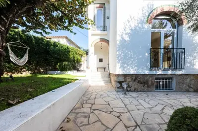 a house with a stone walkway in front of it at Résidence Villa 180m² 5p Cannes Piscine Garage - Villa 180m² 5P Cannes Piscine Garage MAE-2963 in Cannes