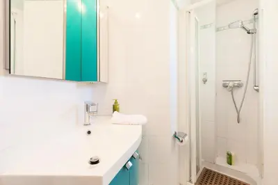 a bathroom with a sink and a shower at Résidence Vue Mer 95m2 Grande Terrasse Cannes Croisette. - Vue mer 95m2 Grande Terrasse Cannes Croisette. MAE-3003 in Cannes