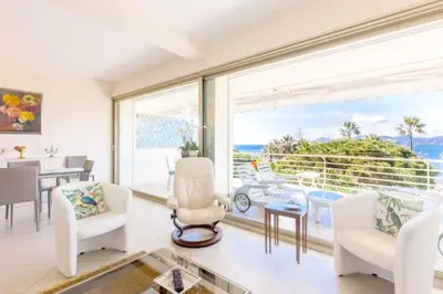 a living room with a view of the ocean at Résidence Vue Mer 95m2 Grande Terrasse Cannes Croisette. - Vue mer 95m2 Grande Terrasse Cannes Croisette. MAE-3003 in Cannes