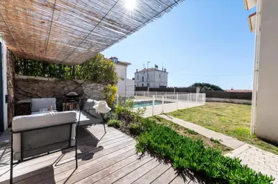 a patio with a couch on a wooden deck at Résidence 2p Duplex 75m² Avec Piscine - 2P Duplex 75m² avec Piscine MAE-3023 in Cannes
