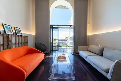 a living room with a couch and a table at Résidence 2p Duplex 75m² Avec Piscine - 2P Duplex 75m² avec Piscine MAE-3023 in Cannes