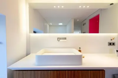 a bathroom with a white sink and a mirror at Résidence 2p Duplex 75m² Avec Piscine - 2P Duplex 75m² avec Piscine MAE-3023 in Cannes