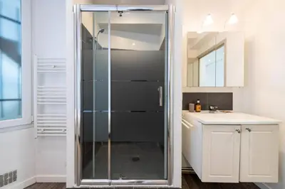 a glass shower in a bathroom with a sink at Résidence 2p Centre-ville Cannes Plages à Pied - 2P Centre-Ville Cannes Plages à Pied MAE-3043 in Cannes