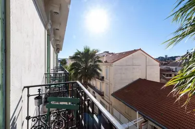 a balcony with a green chair on a building at Résidence 3p Avec Balcons, 3min Du Palais Des Congrès - 3P avec Balcons, 3min du Palais des congrès MAE-3053 in Cannes