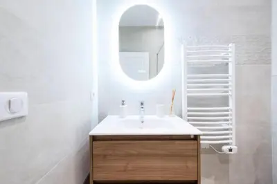 a bathroom with a sink and a mirror at Résidence 3p Avec Balcons, 3min Du Palais Des Congrès - 3P avec Balcons, 3min du Palais des congrès MAE-3053 in Cannes