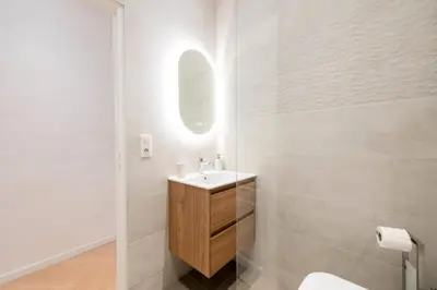 a white bathroom with a sink and a mirror at Résidence 3p Avec Balcons, 3min Du Palais Des Congrès - 3P avec Balcons, 3min du Palais des congrès MAE-3053 in Cannes