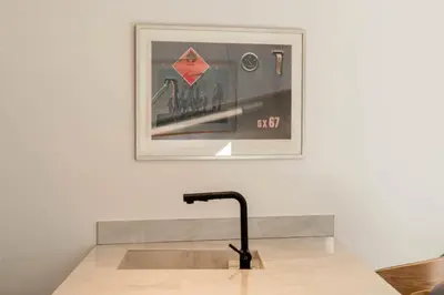 a sink in a room with a picture on the wall at Résidence 2p En Duplex De Standing Au Calme - 2P en Duplex de Standing au Calme MAE-3063 in Cannes
