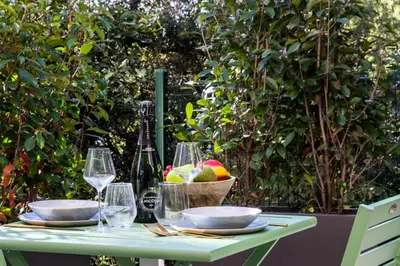 a table with wine glasses and a bowl of fruit at Résidence 2p En Duplex De Standing Au Calme - 2P en Duplex de Standing au Calme MAE-3063 in Cannes