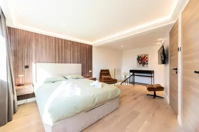 a bedroom with a large bed and a piano at Résidence 2p En Duplex De Standing Au Calme - 2P en Duplex de Standing au Calme MAE-3063 in Cannes