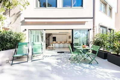 a patio with chairs and a table in front of a building at Résidence 2p En Duplex De Standing Au Calme - 2P en Duplex de Standing au Calme MAE-3063 in Cannes