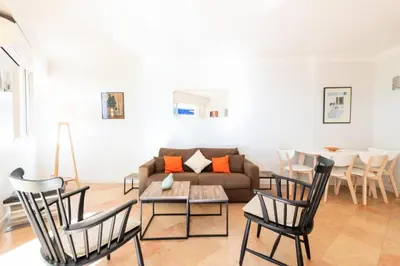 a living room with a couch and chairs and a table at Résidence Rez-de-jardin Croisette Vue Mer Avec Garage - Rez-de-jardin Croisette vue mer avec garage MAE-3083 in Cannes