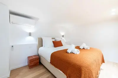 a bedroom with a bed with two towels on it at Résidence 4p Duplex Mansardé, Cœur De Cannes - 4P Duplex Mansardé, Cœur de Cannes MAE-3103 in Cannes