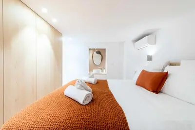a white bedroom with two towels on a bed at Résidence 4p Duplex Mansardé, Cœur De Cannes - 4P Duplex Mansardé, Cœur de Cannes MAE-3103 in Cannes