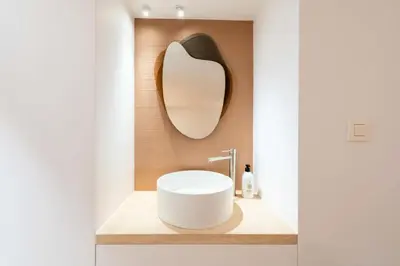a bathroom with a white sink and a mirror at Résidence 4p Duplex Mansardé, Cœur De Cannes - 4P Duplex Mansardé, Cœur de Cannes MAE-3103 in Cannes