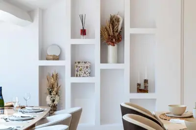 a dining room with a table and chairs at Résidence 4p Duplex Mansardé, Cœur De Cannes - 4P Duplex Mansardé, Cœur de Cannes MAE-3103 in Cannes