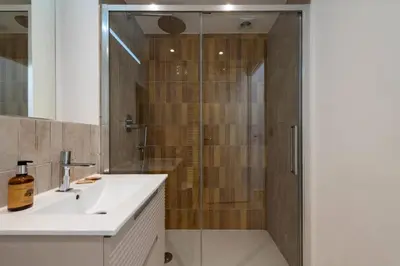 a bathroom with a shower and a white sink at Résidence Studio Terrasse 2 Min De La Croisette - Studio Terrasse 2 min de la Croisette MAE-3113 in Cannes