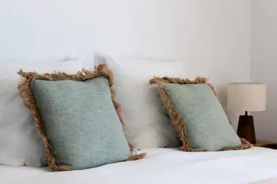 a bed with two pillows on top of it at Résidence Cannes – Suquet Vue Mer & Accès Plage - Cannes – Suquet Vue Mer & Accès Plage MAE-3163 in Cannes