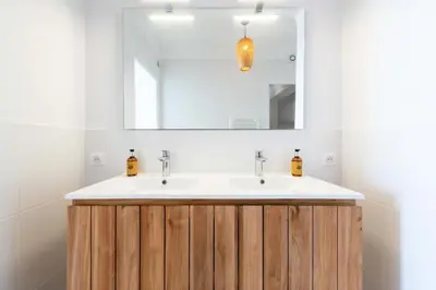 a bathroom with a sink and a mirror at Résidence Cannes – Suquet Vue Mer & Accès Plage - Cannes – Suquet Vue Mer & Accès Plage MAE-3163 in Cannes
