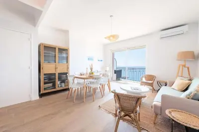 a living room with a couch and a table at Résidence Cannes – Suquet Vue Mer & Accès Plage - Cannes – Suquet Vue Mer & Accès Plage MAE-3163 in Cannes