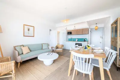 a living room with a couch and a table at Résidence Cannes – Suquet Vue Mer & Accès Plage - Cannes – Suquet Vue Mer & Accès Plage MAE-3163 in Cannes