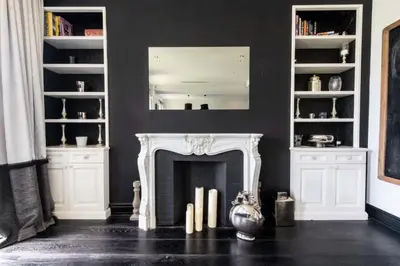 a living room with a fireplace and a mirror at Résidence Prestige Et Confort Face Au Palais Des Festivals - Prestige et Confort Face au Palais des Festivals MAE-3173 in Cannes