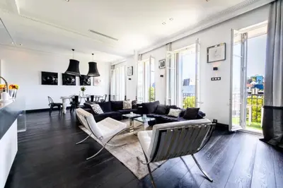 a living room with a couch and a table at Résidence Prestige Et Confort Face Au Palais Des Festivals - Prestige et Confort Face au Palais des Festivals MAE-3173 in Cannes