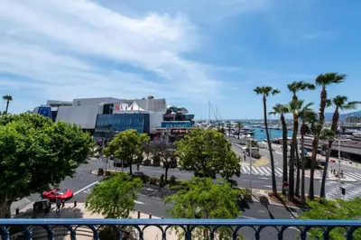 a view of a city with palm trees and a street at Résidence Prestige Et Confort Face Au Palais Des Festivals - Prestige et Confort Face au Palais des Festivals MAE-3173 in Cannes