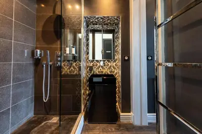 a bathroom with a shower and a mirror at Résidence Prestige Et Confort Face Au Palais Des Festivals - Prestige et Confort Face au Palais des Festivals MAE-3173 in Cannes