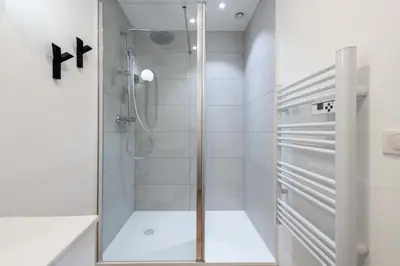 a shower with a glass door in a bathroom at Résidence 3p Terrasse & Calme Cannes Centre - 3P Terrasse & Calme Cannes Centre MAE-3213 in Cannes