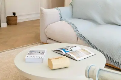 a white coffee table in a living room with a couch at Résidence 4p Bourgeois Rez-de-jardin, Proche Croisette & Plages - 4P Bourgeois Rez-de-jardin, proche Croisette & Plages MAE-3243 in Cannes