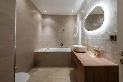 a bathroom with a tub and a sink and a mirror at Résidence 4p Bourgeois Rez-de-jardin, Proche Croisette & Plages - 4P Bourgeois Rez-de-jardin, proche Croisette & Plages MAE-3243 in Cannes