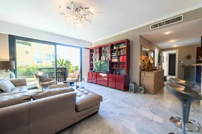 a living room with a couch and a chandelier at Résidence 4p Piscine Privée & Vue Mer - 4P Piscine privée & Vue mer MAE-3263 in Cannes