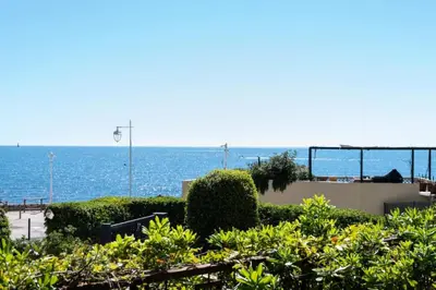 a view of the ocean from a building at Résidence 4p Piscine Privée & Vue Mer - 4P Piscine privée & Vue mer MAE-3263 in Cannes