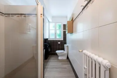 a small bathroom with a toilet and a window at Résidence 2p Rez-de-jardin Au Calme – Cadre Paisible - 2P Rez-de-jardin au calme – Cadre Paisible MAE-3313 in Cannes