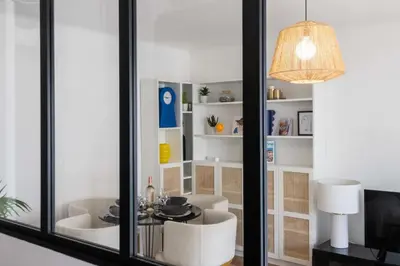 a room with a table and chairs and a mirror at Résidence 2p Terrasse – Palm Beach, Proche Plages - 2P Terrasse – Palm Beach, Proche Plages MAE-2753 in Cannes