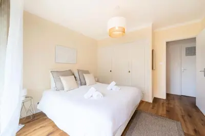 a bedroom with a white bed with towels on it at Résidence 2p Terrasse – Palm Beach, Proche Plages - 2P Terrasse – Palm Beach, Proche Plages MAE-2753 in Cannes