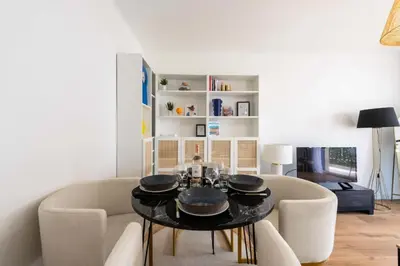 a living room with a table and chairs at Résidence 2p Terrasse – Palm Beach, Proche Plages - 2P Terrasse – Palm Beach, Proche Plages MAE-2753 in Cannes