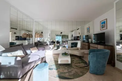 a living room with a couch and a table at Résidence 3p Résidence Avec Piscine, Proche Croisette - 3P Résidence avec piscine, proche Croisette MAE-2773 in Cannes