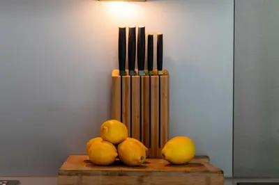 a pile of oranges and lemons on a wooden table at Résidence 2p Rez-de-jardin Avec Piscine – Calme, Parking Privé - 2P Rez-de-jardin avec piscine – Calme, Parking privé MAE-2133 in Cannes